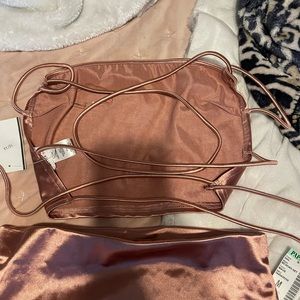 Brand new woman’s pink skirt and crop cross top